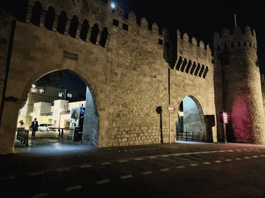 A gate of the Old City at night