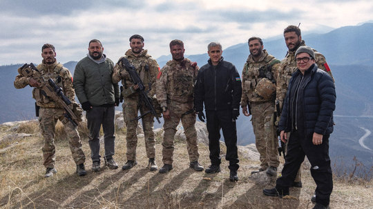 Cast and crew on a mountain location
