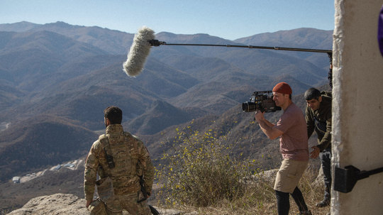 Filming on a mountain ridge