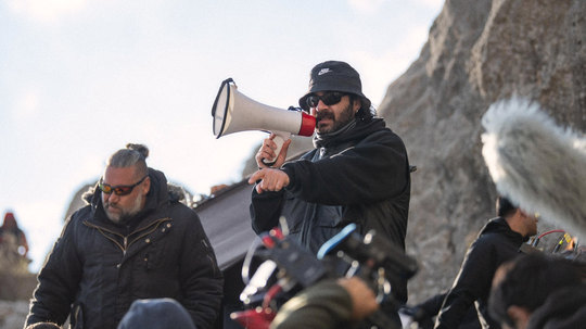 Directing a scene with a megaphone