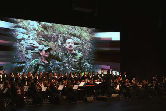 The film on the big screen with a live orchestra