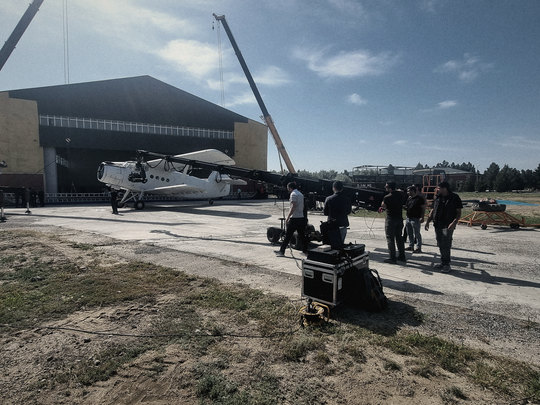 Crew preparing a shot by the hangar
