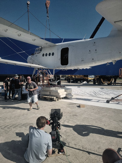 Crew filming the An-2 in front of the blue screen