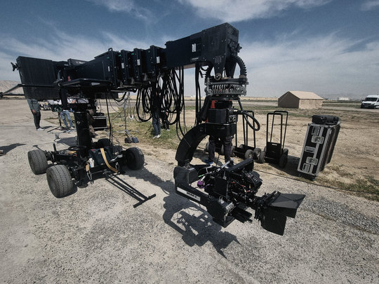 Camera crane and crew between setups
