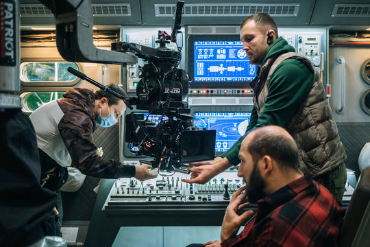 The camera team at the cockpit controls