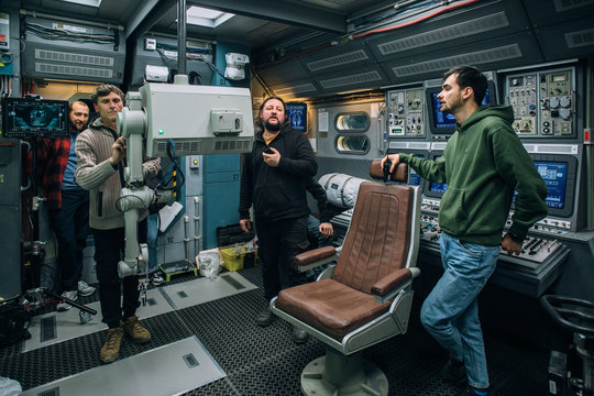 The robot and the pilot seat on set