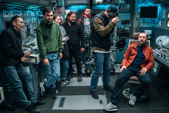 The crew in the cockpit between takes