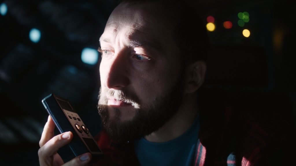 Film still from U Are the Universe: a radio call in the dark cabin